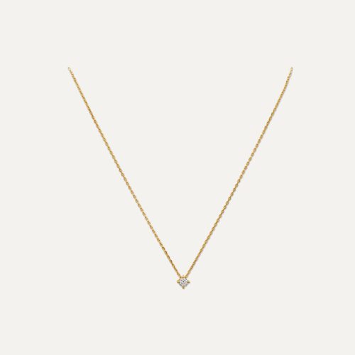 Collana d'oro con pendente brillante.