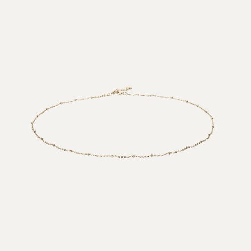 Collana delicata in oro con design elegante.