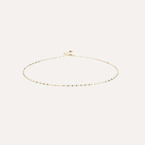 Bracciale dorato elegante con design delicato.